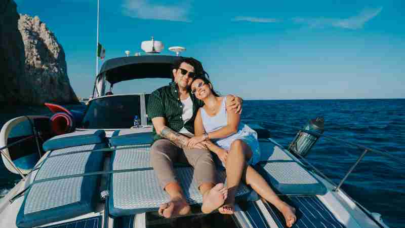 Happy couple enjoying a relaxing day on a yacht under clear blue skies in the Mediterranean Sea., tags: coppie - pexel